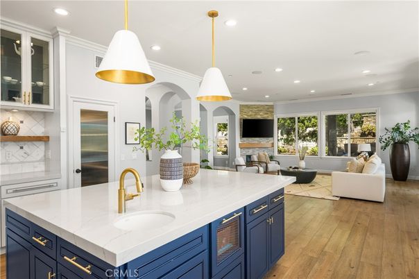 Fireplace, Interior, Kitchen, Living room, Pendant Lights, Recessed Lighting, Stainless Steel Appliances, Wood Texture Flooring
