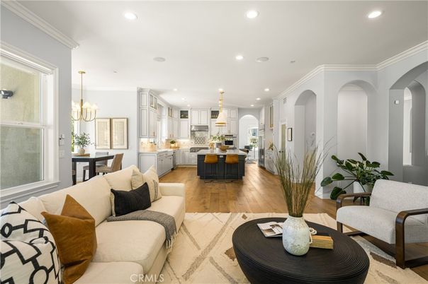 Chandelier, Dining room, Interior, Kitchen, Living room, Pendant Lights, Recessed Lighting, Stainless Steel Appliances, Wood Texture Flooring