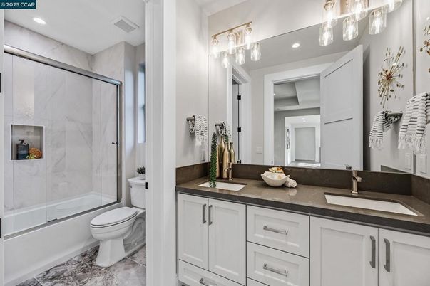 Bathroom, Dual Sink Vanities, Glass Shower, Interior, Marble Walls, Recessed Lighting