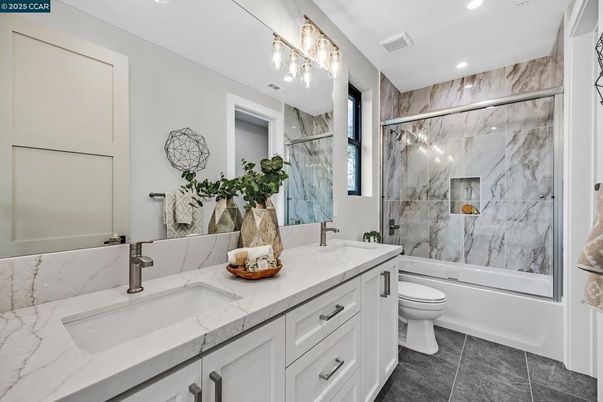 Bathroom, Dual Sink Vanities, Glass Shower, Interior, Marble Walls, Recessed Lighting