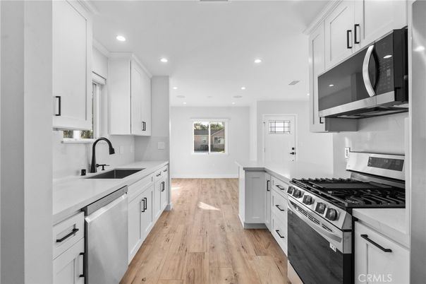 Interior, Kitchen, Recessed Lighting, Stainless Steel Appliances, Wood Texture Flooring