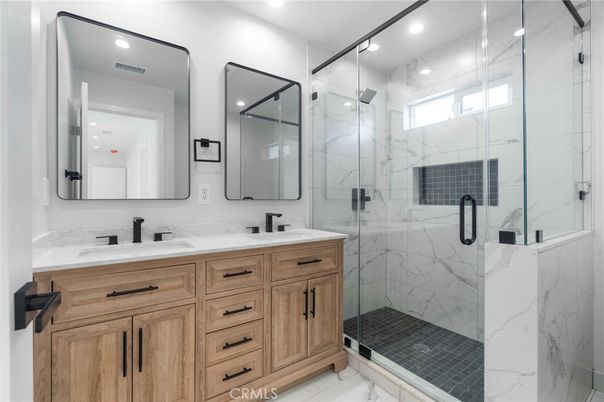 Bathroom, Dual Sink Vanities, Glass Shower, Interior, Marble Walls, Recessed Lighting