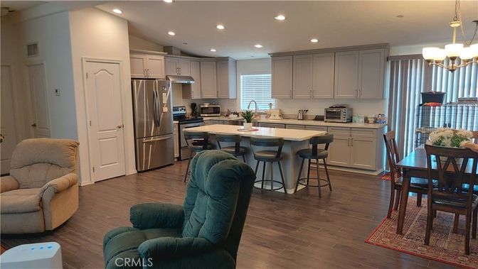 Chandelier, Dining room, Interior, Kitchen, Pendant Lights, Recessed Lighting, Stainless Steel Appliances, Wood Texture Flooring