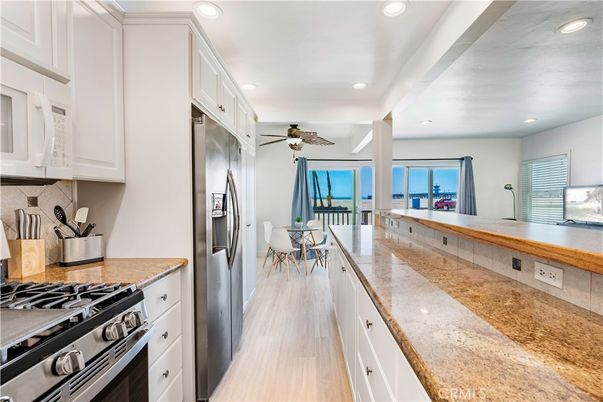 Dining room, Interior, Kitchen, Recessed Lighting, Stainless Steel Appliances, Water, Wood Texture Flooring