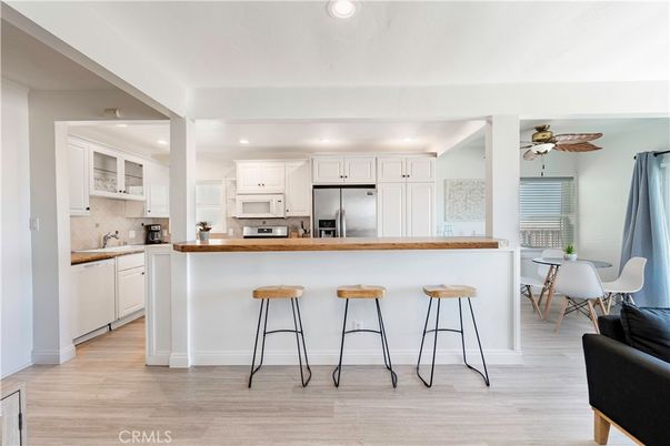 Dining room, Interior, Kitchen, Recessed Lighting, Stainless Steel Appliances, Wood Texture Flooring