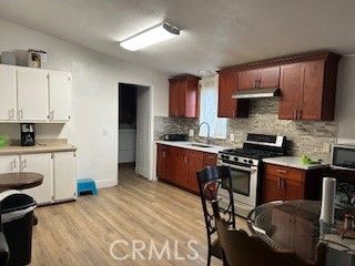 Interior, Kitchen, Stainless Steel Appliances, Stone Walls, Wood Texture Flooring