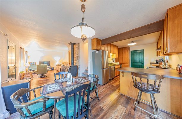Dining room, Interior, Kitchen, Living room, Pendant Lights, Stainless Steel Appliances, Wooden Beams, Wood Texture Flooring