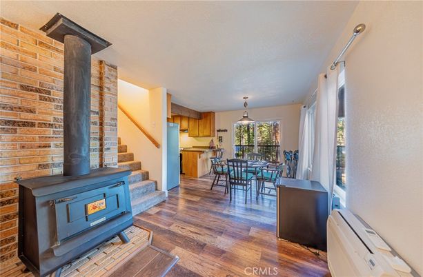 Dining room, Fireplace, Interior, Kitchen, Pendant Lights, Stone Walls, Wood Texture Flooring
