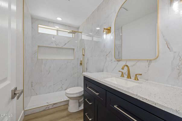 Bathroom, Glass Shower, Interior, Marble Walls, Recessed Lighting, Wood Texture Flooring
