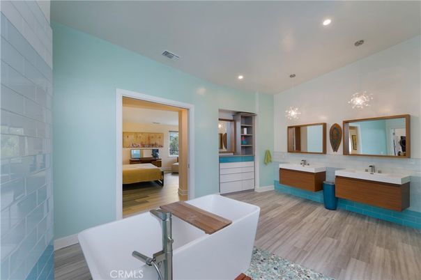 Bathroom, Dual Sink Vanities, Free Standing Baths, Interior, Pendant Lights, Recessed Lighting, Wood Texture Flooring