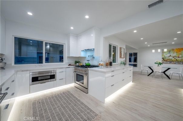 Dining room, Interior, Kitchen, Pendant Lights, Recessed Lighting, Stainless Steel Appliances, Wood Texture Flooring