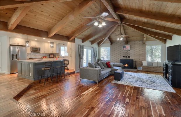 Fireplace, Interior, Kitchen, Living room, Pendant Lights, Recessed Lighting, Stainless Steel Appliances, Stone Walls, Wooden Beams, Wooden Ceilings, Wood Texture Flooring