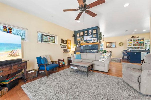 Dining room, Fireplace, Interior, Living room, Recessed Lighting, Water, Wood Texture Flooring