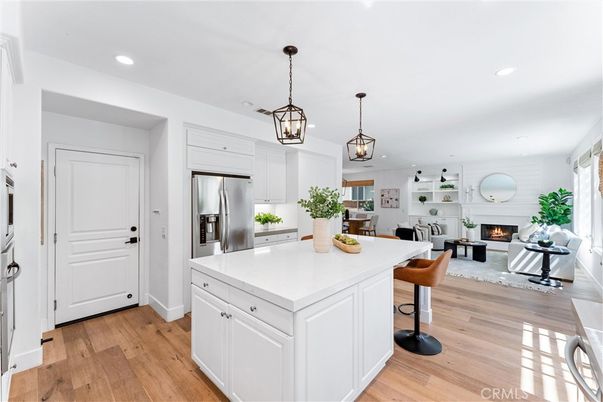Dining room, Fireplace, Interior, Kitchen, Living room, Pendant Lights, Recessed Lighting, Stainless Steel Appliances, Wood Texture Flooring