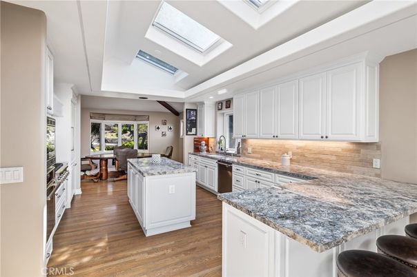 Dining room, Interior, Kitchen, Living room, Recessed Lighting, Stainless Steel Appliances, Wood Texture Flooring
