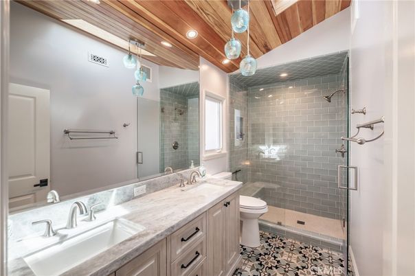 Bathroom, Dual Sink Vanities, Glass Shower, Interior, Pendant Lights, Recessed Lighting, Wooden Ceilings
