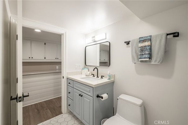 Bathroom, Dual Sink Vanities, Interior, Recessed Lighting, Wood Texture Flooring