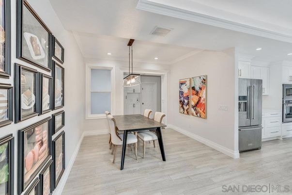Dining room, Interior, Kitchen, Pendant Lights, Recessed Lighting, Stainless Steel Appliances, Wood Texture Flooring