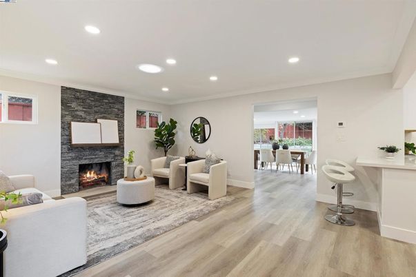 Dining room, Fireplace, Interior, Living room, Recessed Lighting, Stone Walls, Wood Texture Flooring