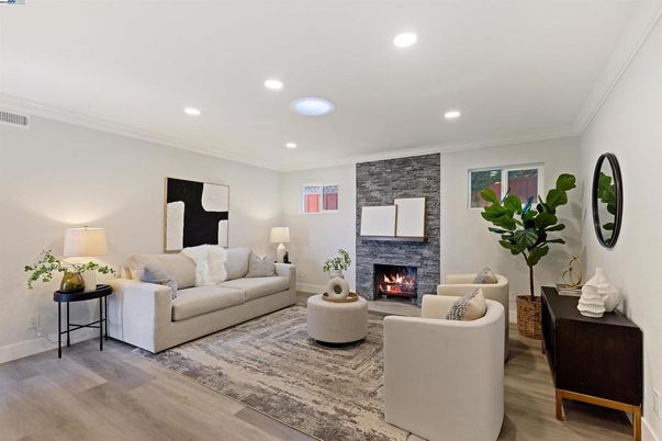 Fireplace, Interior, Living room, Recessed Lighting, Stone Walls, Wood Texture Flooring
