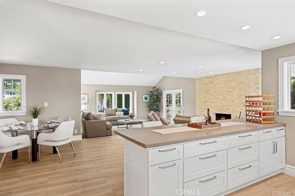 Dining room, Fireplace, Interior, Living room, Recessed Lighting, Stone Walls, Wood Texture Flooring