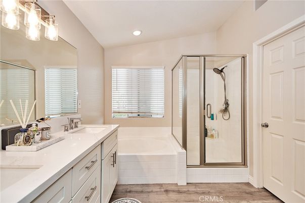 Bathroom, Dual Sink Vanities, Glass Shower, Interior, Recessed Lighting, Wood Texture Flooring