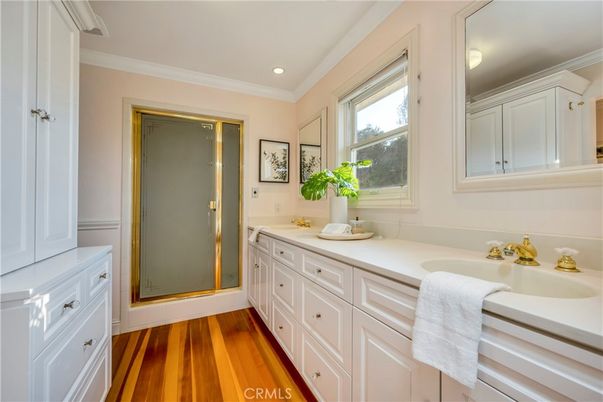 Bathroom, Dual Sink Vanities, Glass Shower, Interior, Recessed Lighting, Wood Texture Flooring