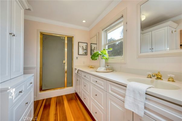 Bathroom, Dual Sink Vanities, Glass Shower, Interior, Recessed Lighting, Wood Texture Flooring