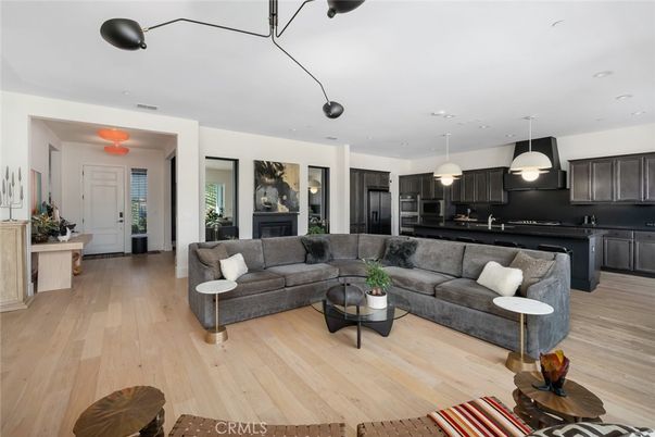 Fireplace, Interior, Kitchen, Living room, Pendant Lights, Recessed Lighting, Stainless Steel Appliances, Wood Texture Flooring