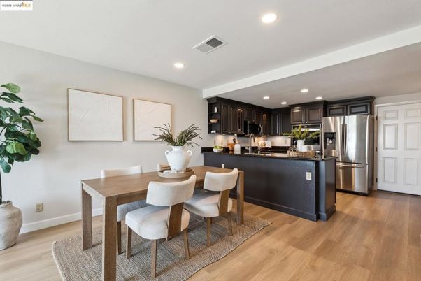 Dining room, Interior, Kitchen, Recessed Lighting, Stainless Steel Appliances, Wood Texture Flooring