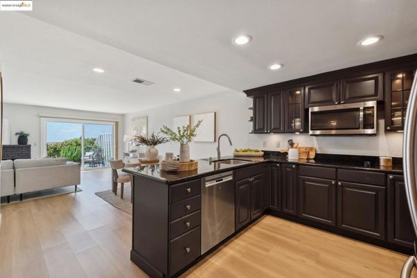 Dining room, Interior, Kitchen, Living room, Recessed Lighting, Stainless Steel Appliances, Wood Texture Flooring