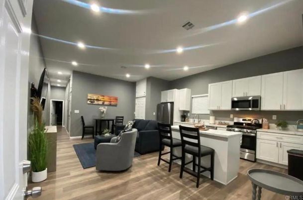 Dining room, Interior, Kitchen, Living room, Recessed Lighting, Stainless Steel Appliances, Wood Texture Flooring