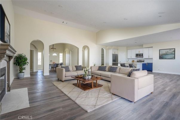 Fireplace, Interior, Kitchen, Living room, Pendant Lights, Recessed Lighting, Stainless Steel Appliances, Wood Texture Flooring