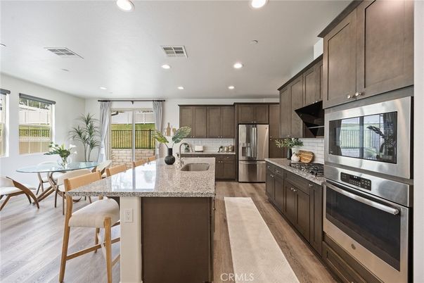 Dining room, Interior, Kitchen, Recessed Lighting, Stainless Steel Appliances, Wood Texture Flooring