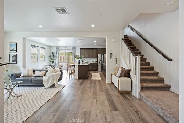 Dining room, Interior, Kitchen, Living room, Recessed Lighting, Stainless Steel Appliances, Wood Texture Flooring