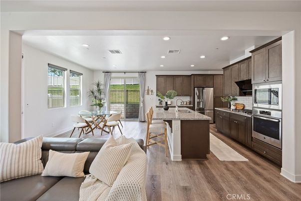 Dining room, Interior, Kitchen, Recessed Lighting, Stainless Steel Appliances, Wood Texture Flooring