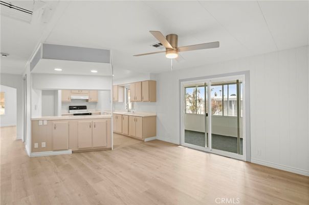 Empty room, Interior, Kitchen, Recessed Lighting, Stainless Steel Appliances, Wood Texture Flooring