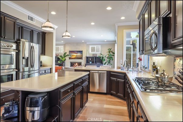 Fireplace, Interior, Kitchen, Pendant Lights, Recessed Lighting, Stainless Steel Appliances, Wood Texture Flooring
