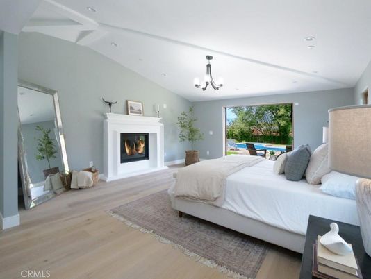 Bedroom, Chandelier, Fireplace, Interior, Recessed Lighting, Wood Texture Flooring