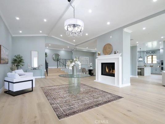 Chandelier, Fireplace, Interior, Kitchen, Living room, Pendant Lights, Recessed Lighting, Wood Texture Flooring