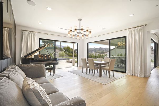 Chandelier, Dining room, Interior, Living room, Piano, Recessed Lighting, Wood Texture Flooring