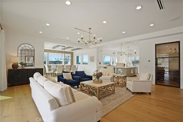 Chandelier, Dining room, Interior, Kitchen, Living room, Pendant Lights, Recessed Lighting, Wood Texture Flooring