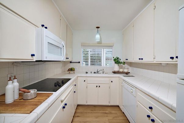 Interior, Kitchen, Pendant Lights, Tile Countertops, Wood Texture Flooring