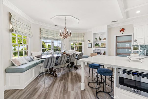 Chandelier, Dining room, Interior, Kitchen, Recessed Lighting, Stainless Steel Appliances, Wood Texture Flooring