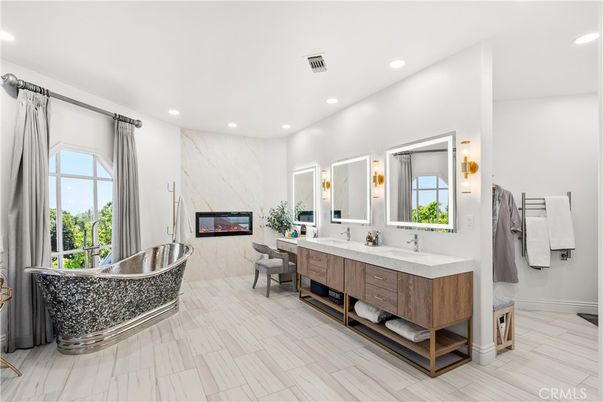 Bathroom, Dual Sink Vanities, Free Standing Baths, Interior, Marble, Marble Walls, Recessed Lighting, Wood Texture Flooring