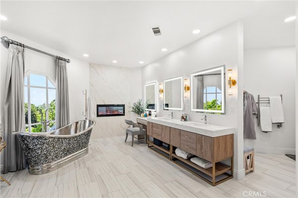 Bathroom, Dual Sink Vanities, Interior, Marble Walls, Recessed Lighting, Wood Texture Flooring