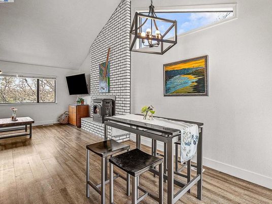Dining room, Fireplace, Interior, Pendant Lights, Stone Walls, Wood Texture Flooring