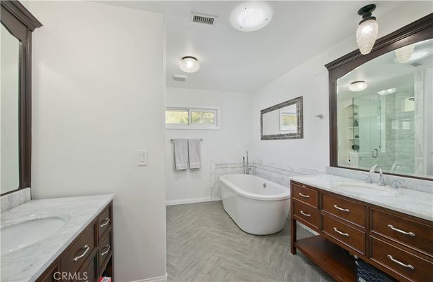 Bathroom, Dual Sink Vanities, Free Standing Baths, Glass Shower, Interior, Wood Texture Flooring