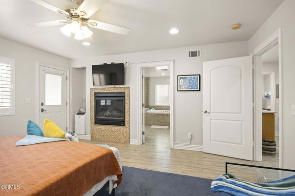 Bedroom, Fireplace, Interior, Recessed Lighting, Wood Texture Flooring
