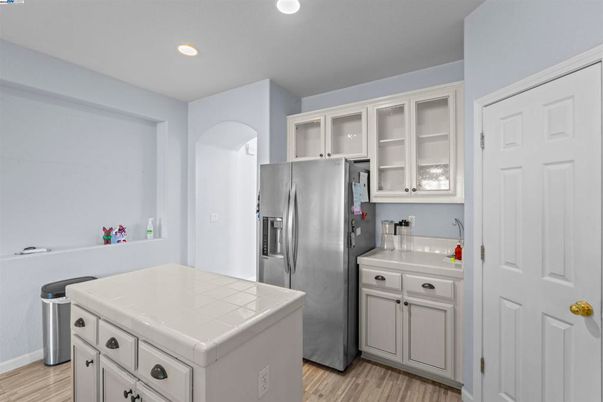 Interior, Kitchen, Recessed Lighting, Stainless Steel Appliances, Tile Countertops, Wood Texture Flooring
